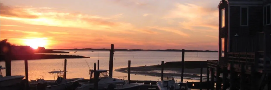 Boats at the Mattakeese Wharf dock on Barnstable Harbor