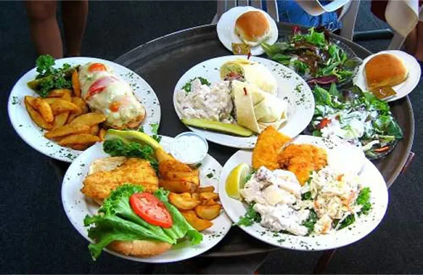 A tray of fried and baked seafood plates