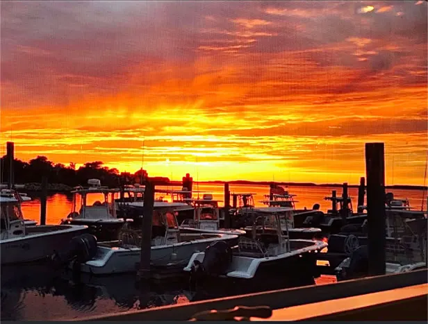 Sunset glow across the harbor, August 2022